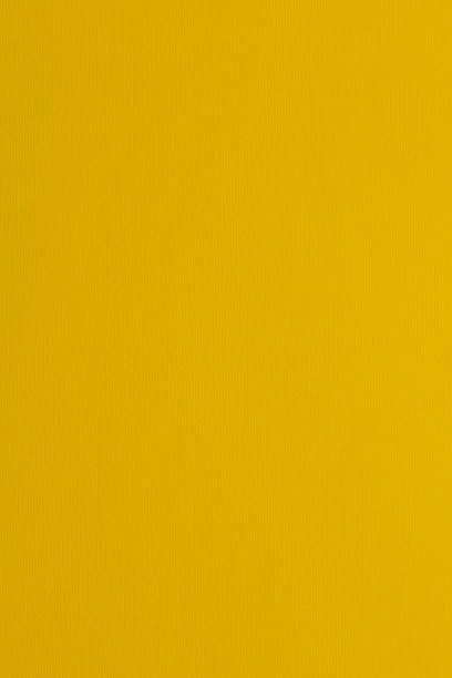 istock Textured grooved paper surface in bright yelllow 1345692182