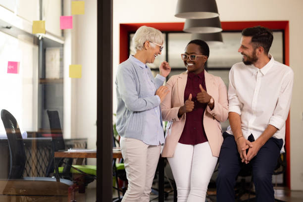 istock Diverse group of coworkers in their office, enjoying their work 1345693018