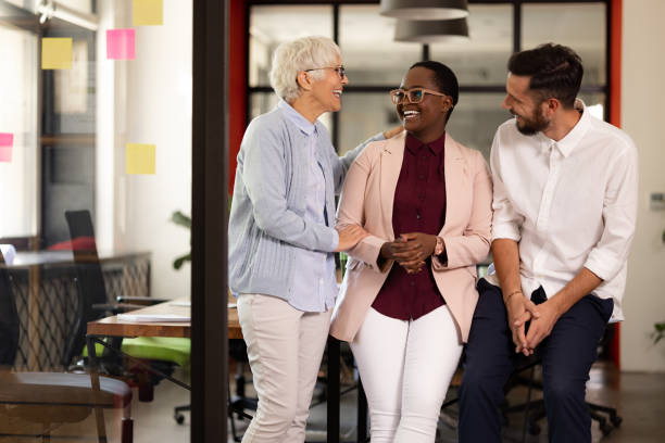 istock Diverse group of coworkers in their office, enjoying their work 1345693067