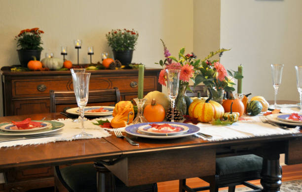 istock Autumn harvest decor on home dining table for family Thanksgiving dinner celebration 1345699672