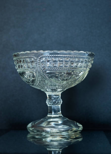 istock Crystal vase for jam or sweets on a black background. Glassware 1345702598