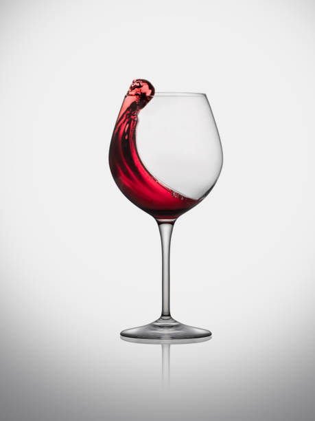 istock red wine splash in glass 1345703466