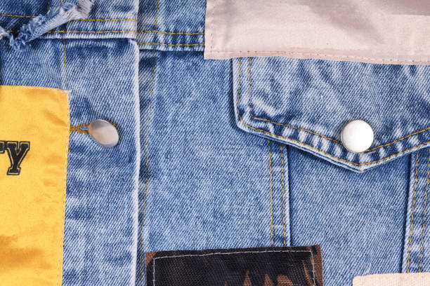 istock Old blue jeans background and texture close up.Denim seam. 1345705980
