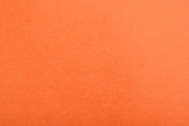 istock Abstract red glossy paper texture background or backdrop. Empty wrapping paper or shiny paperboard for decorative design element. Grainy surface for Christmas holiday or Chinese new year concept 1345706031