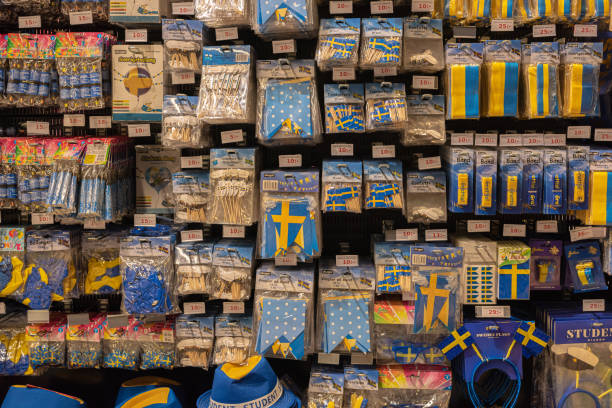 Assortment of blue and yellow colored accesories celebrating swedish end of school Studenten.. Gothenburg, Sweden - May 23 2021: Assortment of blue and yellow colored accesories celebrating swedish end of school Studenten. studenten stock pictures, royalty-free photos & images