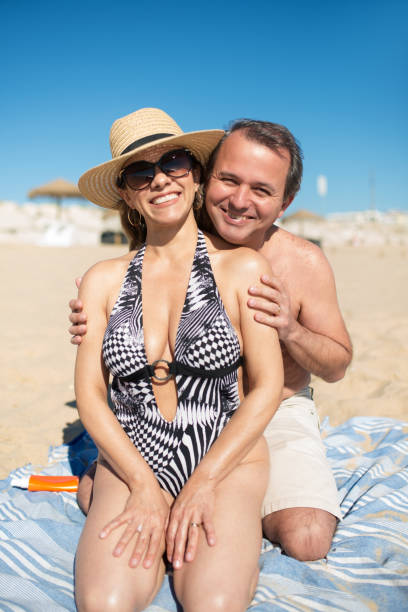 istock Loving wife and husband at beach 1345709630