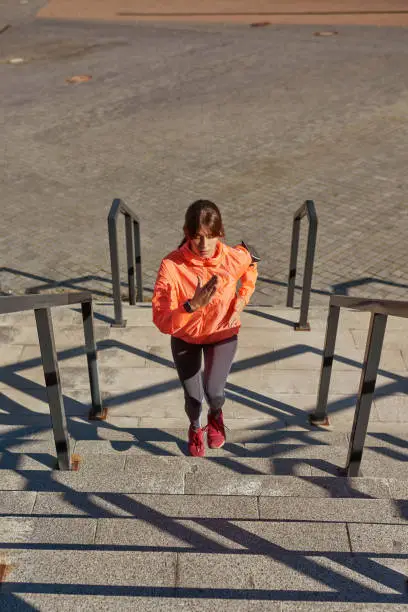 Photo of Active girl runner in sportswear train jog outdoors