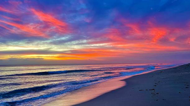istock Colorful beautiful multi colored sunrise sunset on the beach 3 1345718820