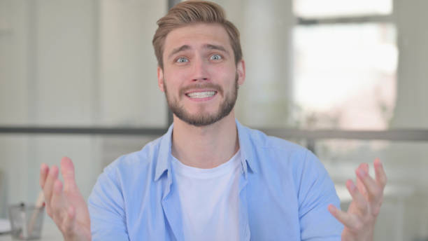 istock Portrait of Angry Young Creative Man Arguing, Fighting 1345718904