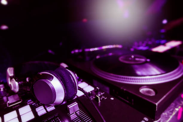 istock Dj mixer, headphones and turntable with record 1345721167
