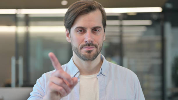 istock Denial, No Sign by Casual Young Man by Finger 1345722039