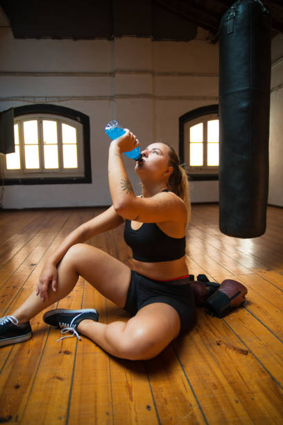 istock Side view of young woman relaxing after training 1345723113