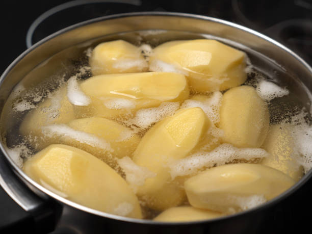 istock Cooking potatos in boiling water in saucepan 1345724419
