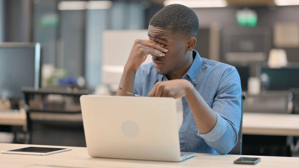 istock African American Man Feeling Tired at Work 1345724433