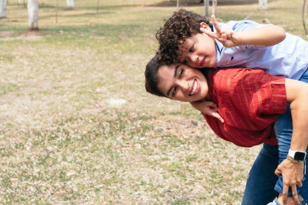 istock mother happy with her son outdoors 1345725913