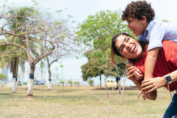 istock mother happy with her son outdoors 1345725916
