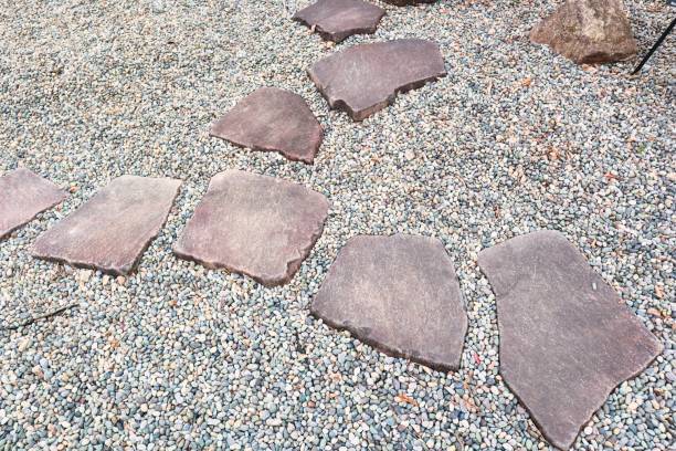 Japanese-style garden gravel and stepping stones stock photo