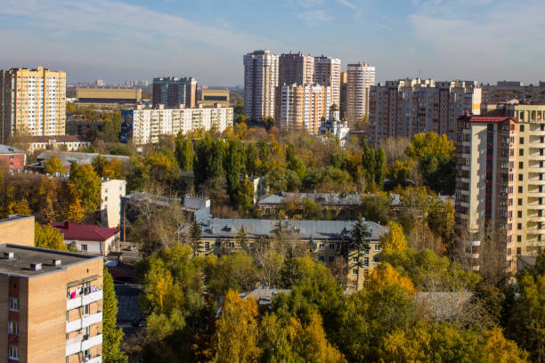 istock panoramic view of modern multi-storey buildings and autumn trees 1345729078