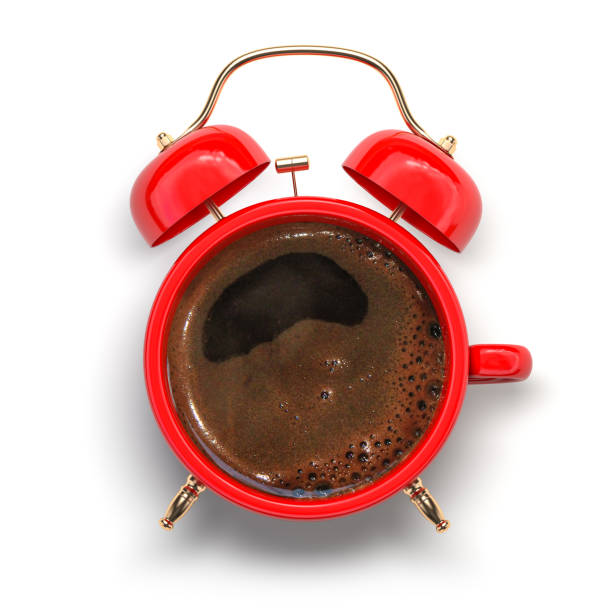istock Red coffee cup with alarm clock. Coffee time and wake up concept. 1345730262