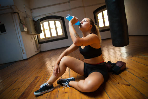 istock Young woman relaxing after training 1345732485