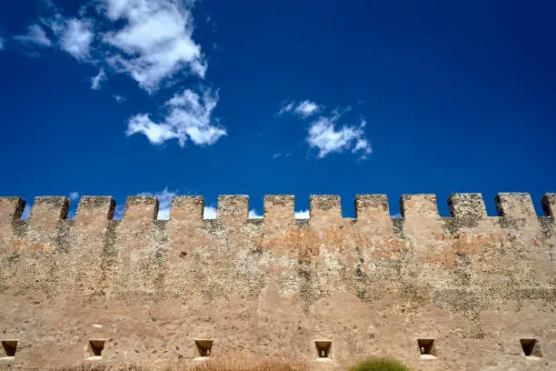 battlements of a medieval wall, the Venetian castle of Frangokastello against the sky on the island of Crete in Greece
