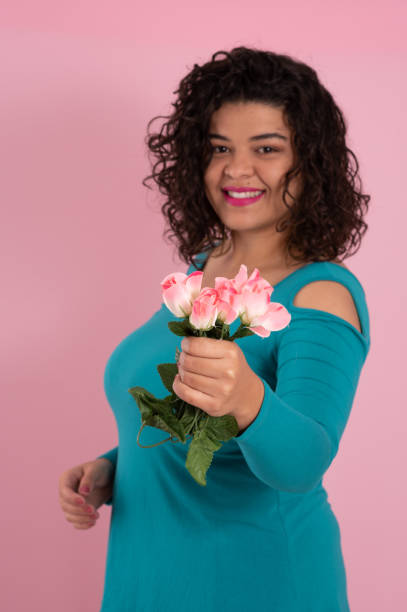 Free Stock Photo of Woman in blue dress holding a pink flower in hand ...