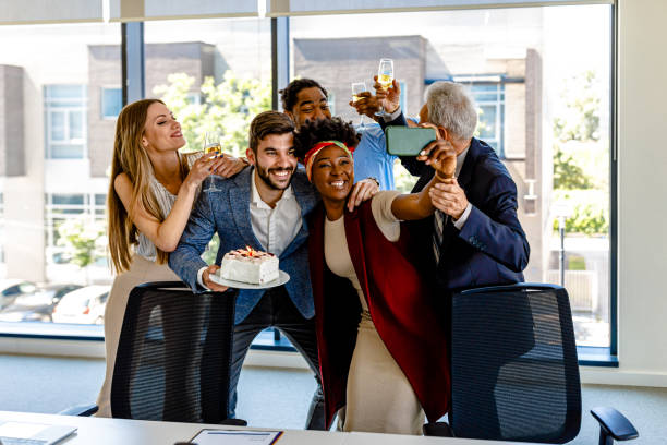 Friendly Multi-Ethnic Employees are Celebrating Birthday Together and Taking a Selfie.