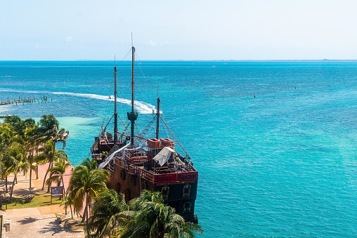 Cancun, Mexico. May 30, 2021. Scenic view of sea and sky with pirate ship moored near park
