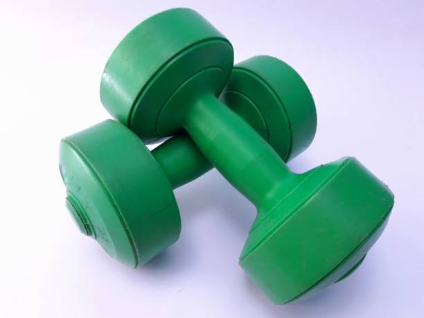 istock Green Dumbbells on isolated white background 1345738180