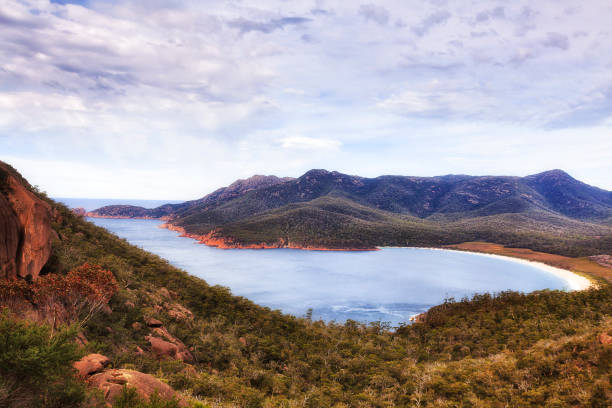 Tas Wineglass Bay above White sand bay of Wineglass bay beach of Freycinet peninsula and national park of Tasmania. honeymoon bay stock pictures, royalty-free photos & images