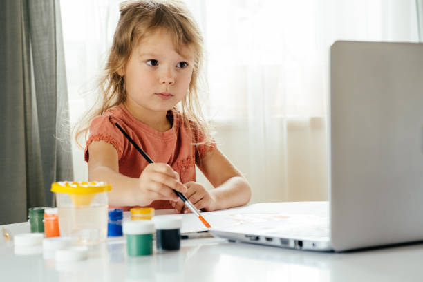 istock The girl drawing the paints. 1345741583