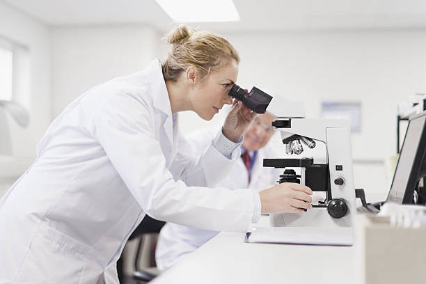 Scientist working in pathology lab  microscope stock pictures, royalty-free photos & images