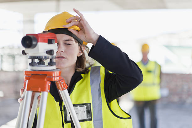 Construction worker using equipment  theodolite photos stock pictures, royalty-free photos & images