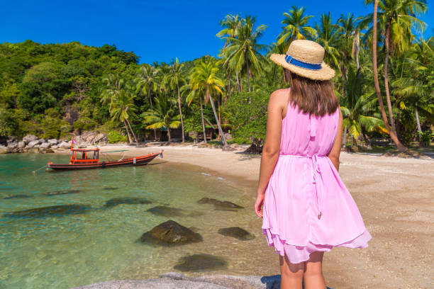 istock Woman at tropical beach 1345754402