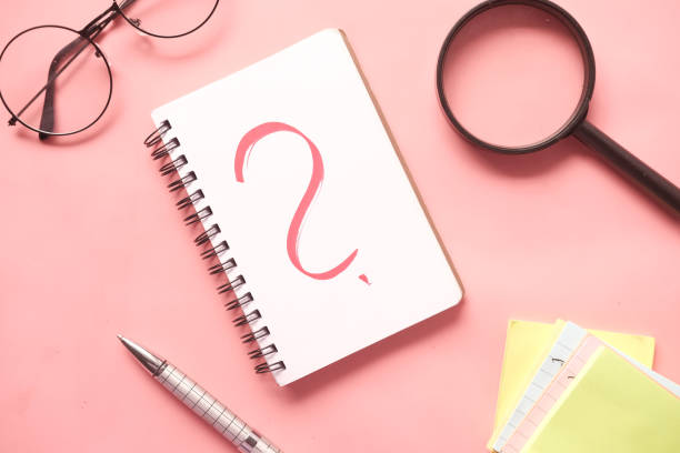 istock high angle view of question mark on paper on office desk 1345755233