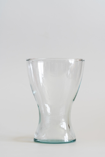 Transparent glass vase isolated on white background
