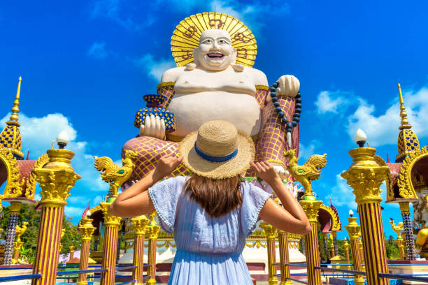 istock Woman at Giant happy buddha Samui 1345759677