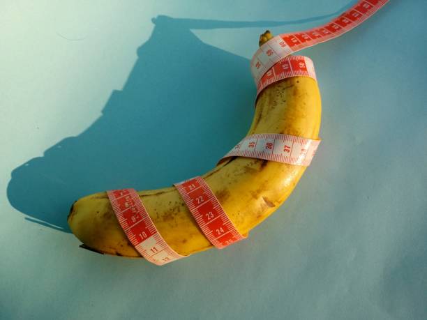 istock Banana wrapped with a tape measure 1345760340