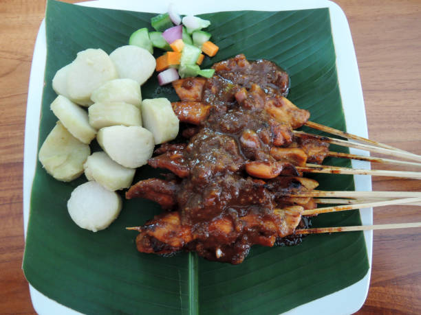 istock Chicken Satay or Sate Ayam or Satay Ayam with Lontong Rice Cake 1345767380