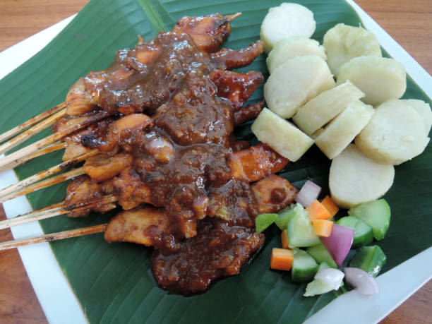 istock Chicken Satay or or Sate Ayam or Satay Ayam with Lontong Rice Cake 1345767381