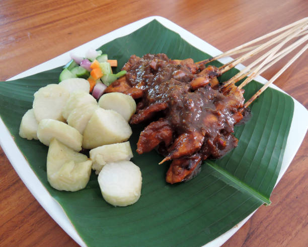 istock Chicken Satay or Sate Ayam or Satay Ayam with Lontong Rice Cake 1345767384
