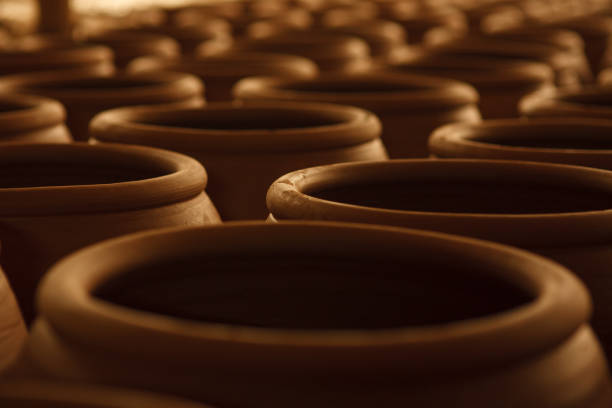 istock Stack of clay vase in the factory. 1345768945