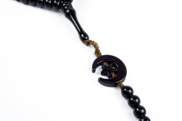 istock Prayer beads in black on a white background 1345776473