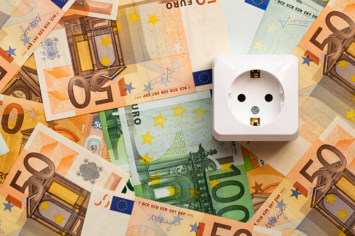 white socket isolated on euro banknotes background