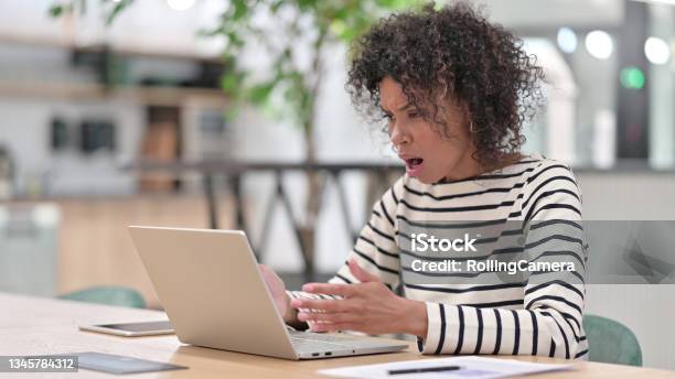 African Woman Reacting To Failure On Laptop In Office Stock Photo - Download Image Now