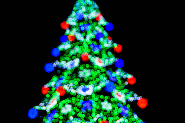 istock Background of the blurred colorful christmas lights. Bokeh pattern 1345785784