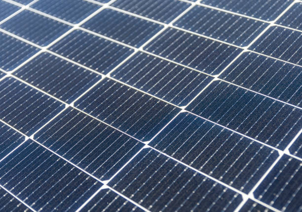 istock Solar photovoltaic modules on a rooftop 1345786341