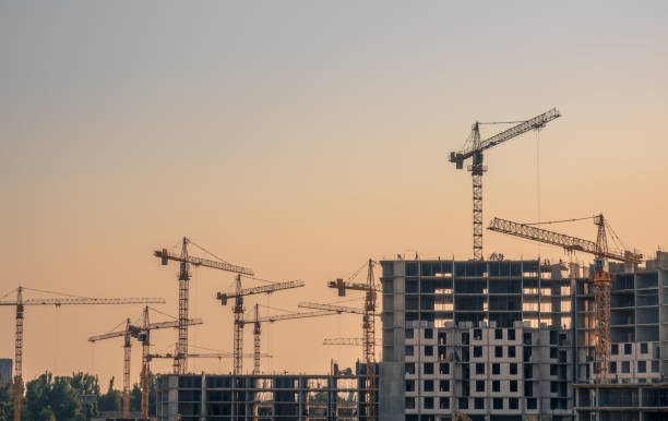 istock Lots of Cranes at the Evening Construction 1345786705