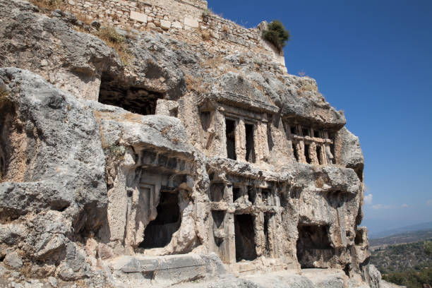 ruins of the ancient town tlos. view of ancient lycian rock tombs date back to 4th century b.c. near the city of fethiye, mugla province, turkey. - mugla province imagens e fotografias de stock