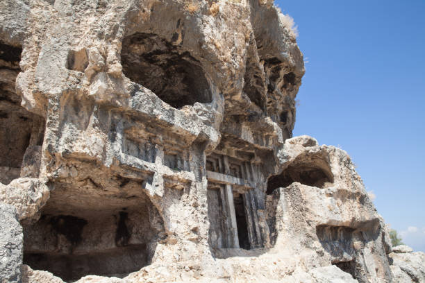 ruins of the ancient town tlos. view of ancient lycian rock tombs date back to 4th century b.c. near the city of fethiye, mugla province, turkey. - mugla province imagens e fotografias de stock